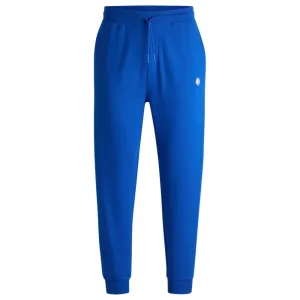 Cotton-terry tracksuit bottoms with Happy HUGO logo patch