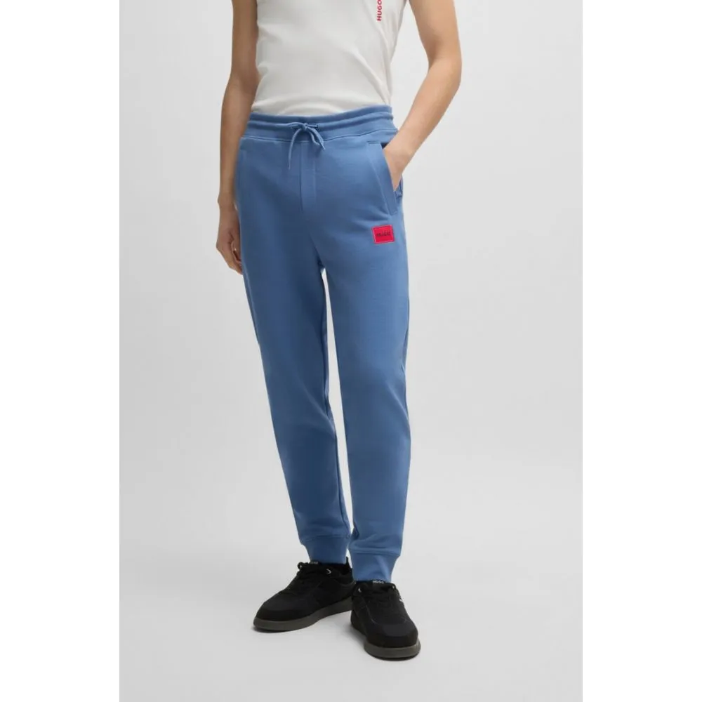 Cotton-terry tracksuit bottoms with red logo label