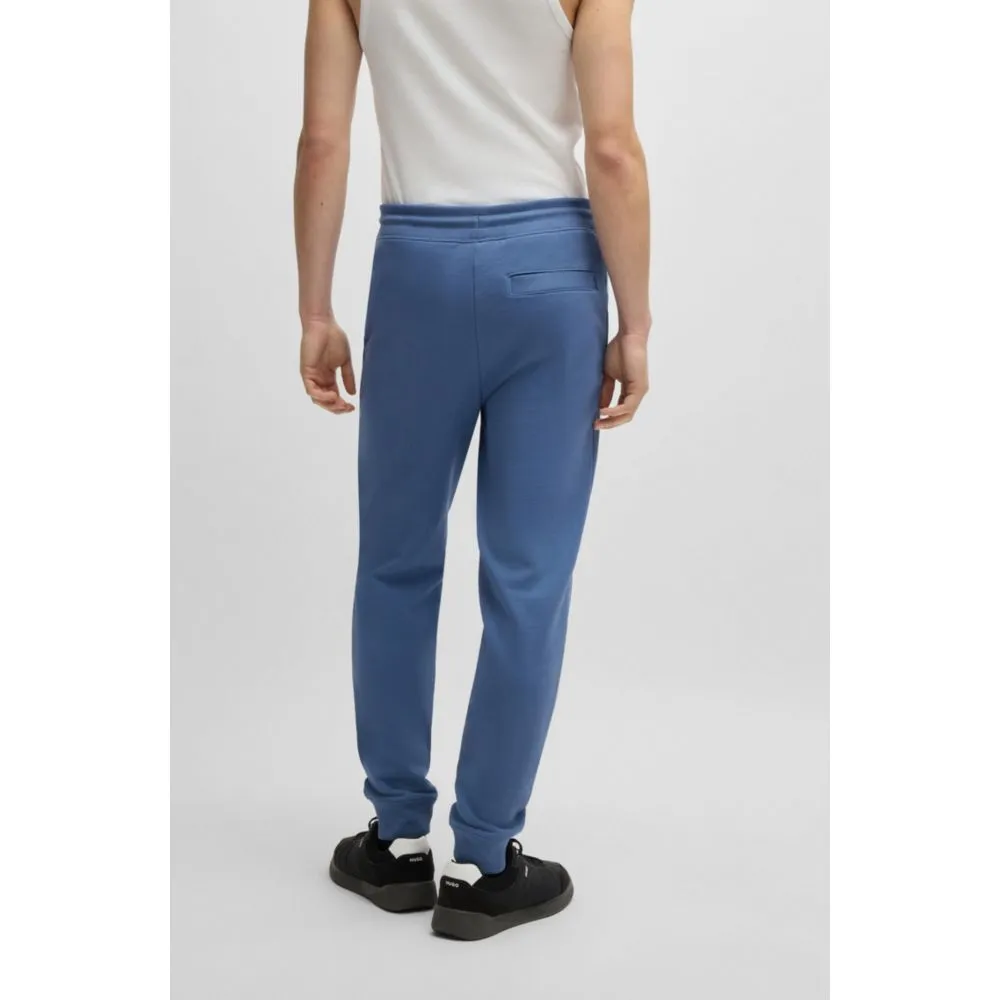 Cotton-terry tracksuit bottoms with red logo label
