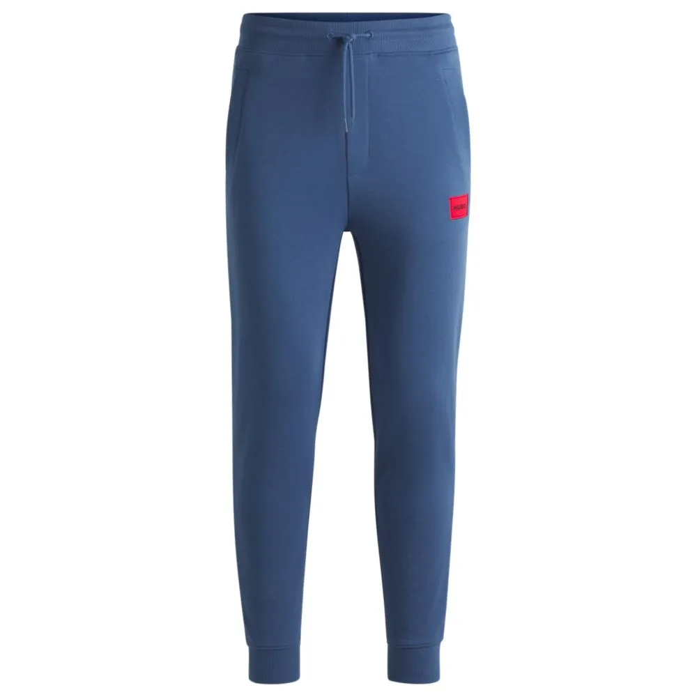 Cotton-terry tracksuit bottoms with red logo label