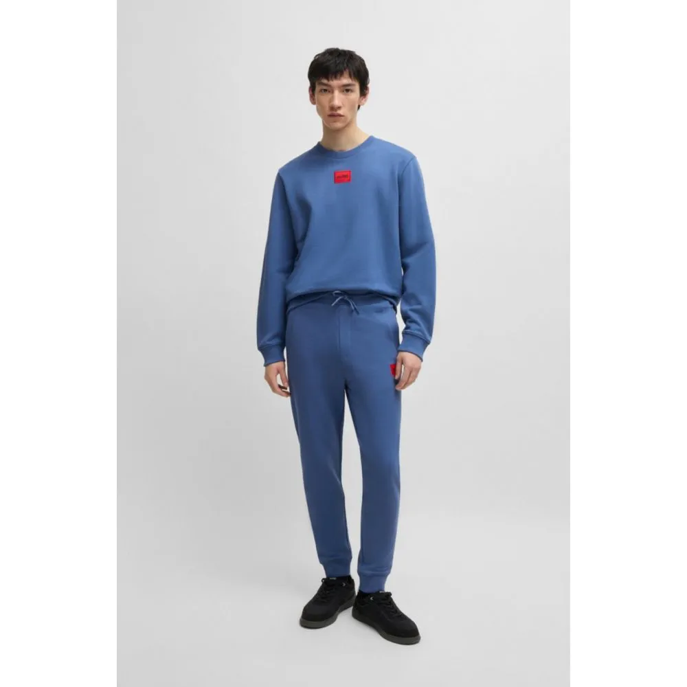 Cotton-terry tracksuit bottoms with red logo label