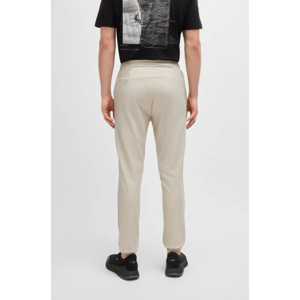 Tracksuit bottoms in stretch fabric with decorative reflective logo