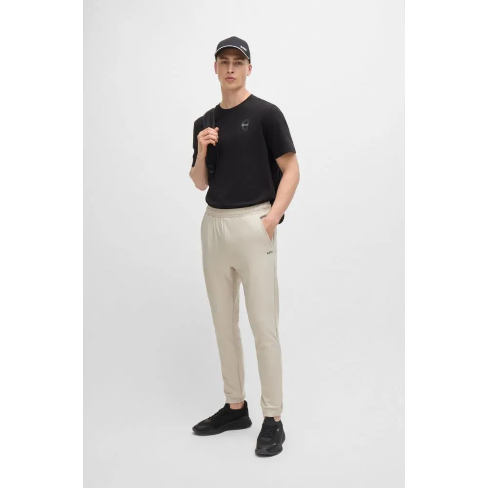 Tracksuit bottoms in stretch fabric with decorative reflective logo