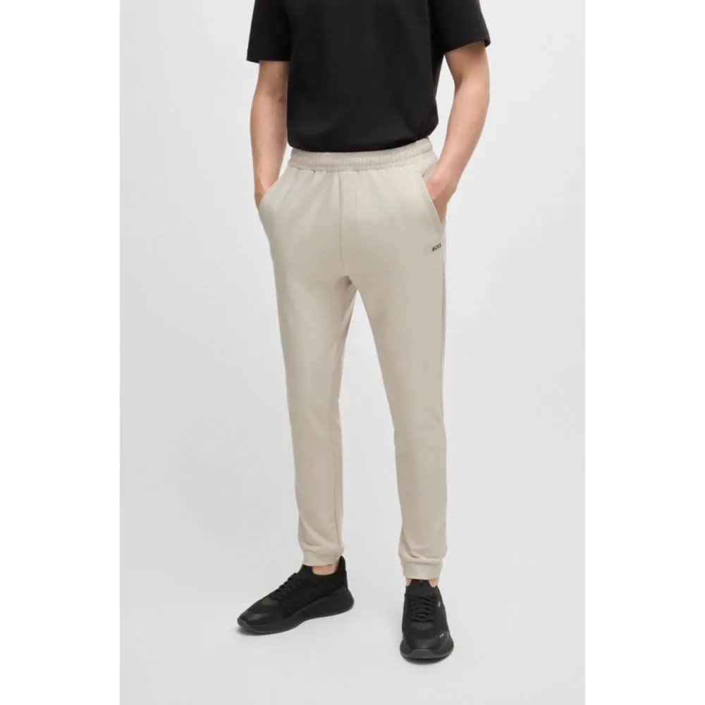 Tracksuit bottoms in stretch fabric with decorative reflective logo