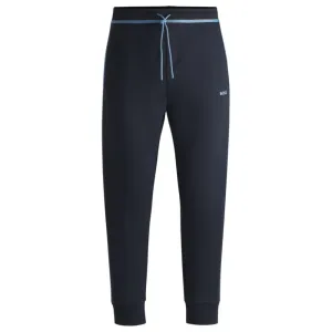 Tracksuit bottoms with tape and logo