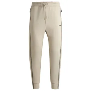 Tracksuit bottoms with tape inserts