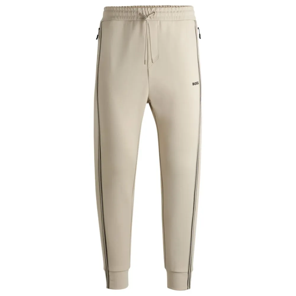 Tracksuit bottoms with tape inserts