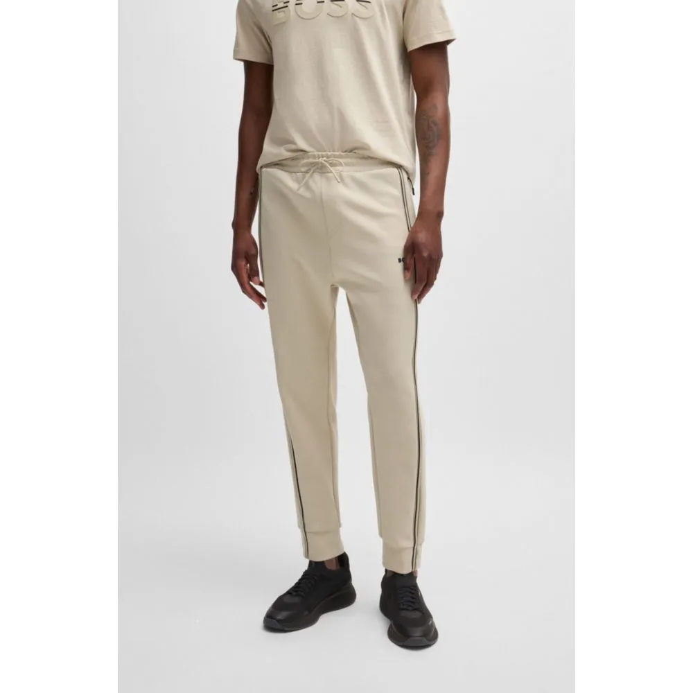 Tracksuit bottoms with tape inserts