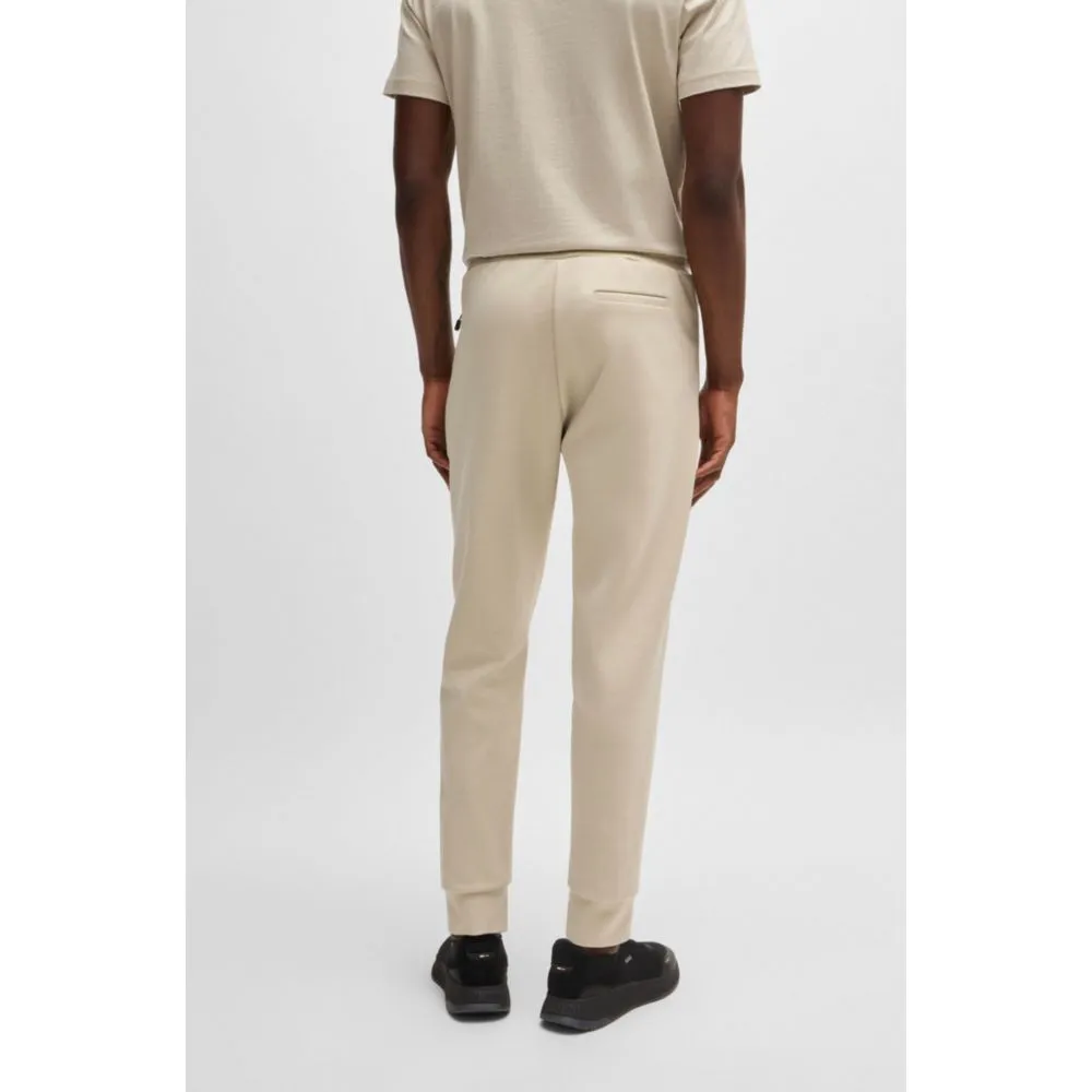 Tracksuit bottoms with tape inserts